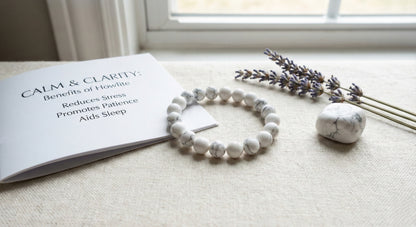 Howlite bracelet and stone beside lavender and booklet listing benefits like reducing stress and aiding sleep