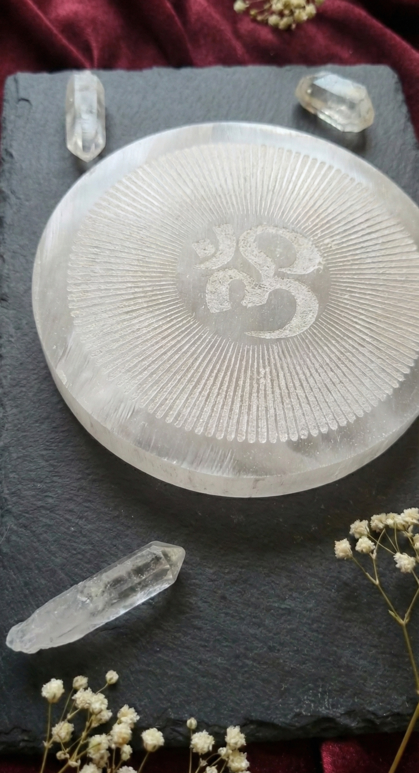 Om Engraved Selenite Charging Plate.